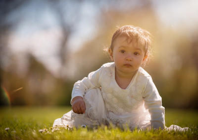 baby girl on the grass by Samantha brown photography