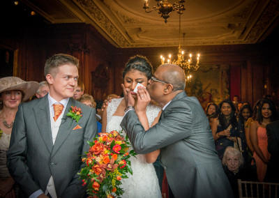dad kisses Bride as he hands her over to be married