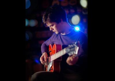 portrait of Andy Frampton at Harmonics guitar shop Crosby by Samantha Brown Photography