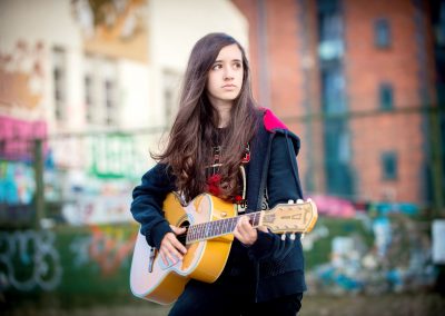 teen girl playing guitar by Samantha Brown photography
