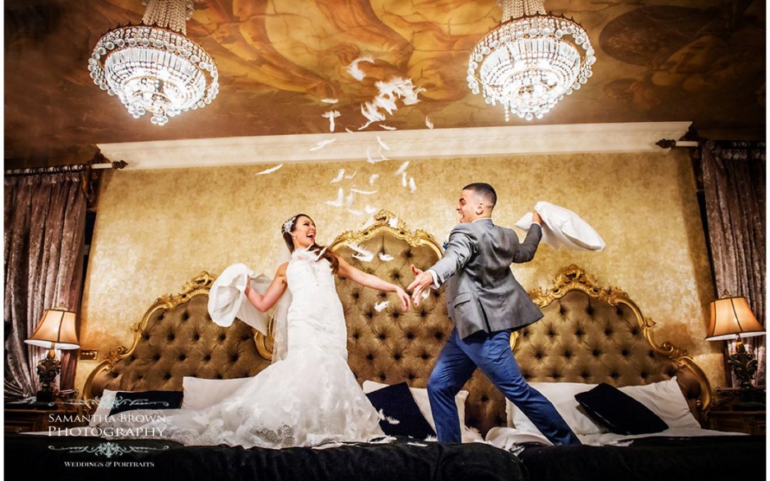 bride and groom having a pillow fight on the bed at 3o James Street