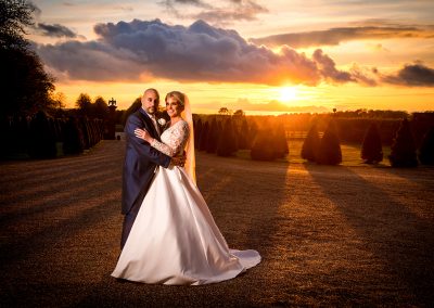 bride and groom at Knowsley Hall in the sunset